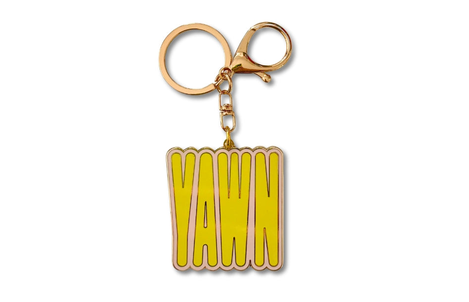 YAWN keychain in yellow and pink with rose gold metal.